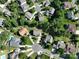 Aerial view of a residential neighborhood with mature trees and well-maintained homes, some with private pools at 4003 Fine Robe Dr, Indian Trail, NC 28079