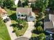 An aerial view of a two-story home with a well-maintained yard, driveway, and mature trees in a suburban setting at 4003 Fine Robe Dr, Indian Trail, NC 28079