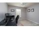 Bedroom with a ceiling fan and a desk setup with multiple monitors, perfect for a home office space at 4003 Fine Robe Dr, Indian Trail, NC 28079