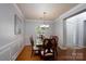 Formal dining room boasts elegant trim, a classic chandelier, and wood flooring at 4003 Fine Robe Dr, Indian Trail, NC 28079