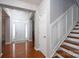 Spacious foyer with hardwood floors, staircase, and ample natural light from the front door at 4003 Fine Robe Dr, Indian Trail, NC 28079