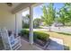 Inviting front porch features rocking chairs and view of manicured landscaping at 4003 Fine Robe Dr, Indian Trail, NC 28079