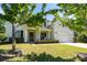Charming two-story home with a well-manicured lawn, a covered front porch, and an attached two-car garage at 4003 Fine Robe Dr, Indian Trail, NC 28079