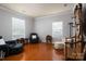 Cozy living room with hardwood floors, neutral walls, and large windows, providing ample natural light at 4003 Fine Robe Dr, Indian Trail, NC 28079