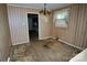 Dining room with dated wallpaper and carpet, presenting an opportunity for renovation and modernization at 402 Villa St, Kannapolis, NC 28083