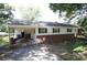 Ranch-style home with carport, brick foundation, and white siding ready for upgrades and personal touches at 402 Villa St, Kannapolis, NC 28083
