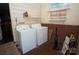 Functional laundry area with washer, dryer, shelving and a window at 402 Villa St, Kannapolis, NC 28083