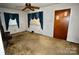 Living room with carpet and large windows provides an opportunity for customization and modern updates at 402 Villa St, Kannapolis, NC 28083