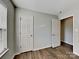 This bedroom offers neutral walls and wood-look floors with plenty of natural light at 4328 Frank Vance Rd, Charlotte, NC 28216
