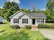 Charming single-story home with gray siding, black shutters, and a neatly maintained front yard at 4328 Frank Vance Rd, Charlotte, NC 28216