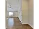 Entryway featuring laminate floors, white trim, and natural light flowing into an open living space at 4328 Frank Vance Rd, Charlotte, NC 28216