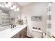 Well-lit bathroom featuring a vanity with storage, a toilet with plants, and a shower with a decorative curtain at 4920 Surfwood Dr, Sherrills Ford, NC 28673