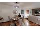 Dining room with a round table, modern light fixture and decorative mirror on the wall at 4920 Surfwood Dr, Sherrills Ford, NC 28673