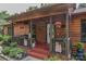 Inviting front porch with hanging flower baskets and decorative elements at 4920 Surfwood Dr, Sherrills Ford, NC 28673