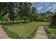 Expansive front yard with mature trees and landscaping at 4920 Surfwood Dr, Sherrills Ford, NC 28673