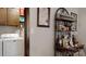 Bright laundry room featuring a washer, dryer, and bar area at 4920 Surfwood Dr, Sherrills Ford, NC 28673