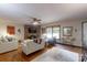Bright living room showcases a brick fireplace, large window, and comfortable seating at 4920 Surfwood Dr, Sherrills Ford, NC 28673