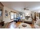 Cozy living room featuring a brick fireplace, hardwood floors, and ample natural light at 4920 Surfwood Dr, Sherrills Ford, NC 28673