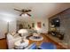 Inviting living room features a brick fireplace, hardwood floors, and comfortable seating arrangement at 4920 Surfwood Dr, Sherrills Ford, NC 28673