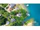 Aerial view of lakefront homes with private docks and lush landscaping at 5075 Lakeview Cir, Sherrills Ford, NC 28673