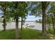 Backyard view with mature trees and boat dock on the lake at 5075 Lakeview Cir, Sherrills Ford, NC 28673