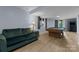 Spacious finished basement with a pool table, a comfortable green sofa, light blue walls, and light wood floors at 5075 Lakeview Cir, Sherrills Ford, NC 28673