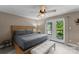 Comfortable bedroom featuring neutral color palette and easy access to the outdoor deck at 5075 Lakeview Cir, Sherrills Ford, NC 28673