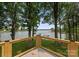 Lake view from the deck with cable railing, wooden posts, and adjacent trees at 5075 Lakeview Cir, Sherrills Ford, NC 28673