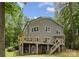 Back exterior of home with multiple decks and stairs to the yard at 5075 Lakeview Cir, Sherrills Ford, NC 28673