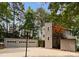 Gray home exterior with a multi-car garage, concrete driveway and basketball hoop at 5075 Lakeview Cir, Sherrills Ford, NC 28673