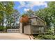 Exterior with gray siding, multiple balconies, and a three-car garage at 5075 Lakeview Cir, Sherrills Ford, NC 28673