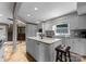 Bright kitchen features a large island with seating, stainless steel appliances, and tiled flooring at 5075 Lakeview Cir, Sherrills Ford, NC 28673