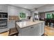 Bright kitchen featuring white cabinets, granite countertops, an island with seating, and stainless appliances at 5075 Lakeview Cir, Sherrills Ford, NC 28673
