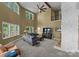 Open living room with high ceilings, a stone fireplace, and plenty of natural light at 5075 Lakeview Cir, Sherrills Ford, NC 28673