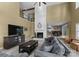 Spacious living room with stone fireplace, vaulted ceilings, and easy access to the dining area at 5075 Lakeview Cir, Sherrills Ford, NC 28673