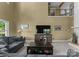 Bright living room featuring vaulted ceilings, upper level overlook, and stone fireplace at 5075 Lakeview Cir, Sherrills Ford, NC 28673