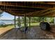 Covered patio space with stone floor, outdoor table, and lake view at 5075 Lakeview Cir, Sherrills Ford, NC 28673