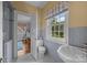 Bathroom featuring classic fixtures and a serene atmosphere, complemented by natural light at 603 S Fulton St, Salisbury, NC 28144