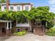Charming brick home featuring a covered porch with lush greenery, creating a welcoming entrance and appealing curb appeal at 603 S Fulton St, Salisbury, NC 28144