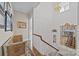 Hallway with stylish wallpaper and decor, leading to stairs and other rooms at 603 S Fulton St, Salisbury, NC 28144