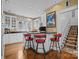 Bright kitchen with white cabinets, black countertops, bar seating, and modern fixtures at 603 S Fulton St, Salisbury, NC 28144