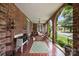 Inviting front porch with brick flooring, wicker seating, and a cozy outdoor living space at 603 S Fulton St, Salisbury, NC 28144