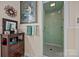 Tiled walk-in shower features updated fixtures, offering a clean and stylish bathing space at 603 S Fulton St, Salisbury, NC 28144