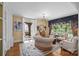 Cozy sitting area with comfortable seating, hardwood floors, and French doors to an outdoor area at 603 S Fulton St, Salisbury, NC 28144