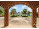 A framed view of the landscaped yard and pond with fountain at 6823 Manatee Dr, Concord, NC 28025