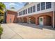 Stately brick home exterior with arched columns and ample outdoor patio space at 6823 Manatee Dr, Concord, NC 28025