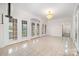 Elegant hallway featuring gleaming marble floors, decorative chandelier, and arched doorways at 6823 Manatee Dr, Concord, NC 28025