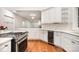 Bright, elegant kitchen with granite countertops, and stainless steel appliances at 6823 Manatee Dr, Concord, NC 28025