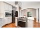 Kitchen featuring a stainless steel oven, and a kitchen island with barstool seating at 6823 Manatee Dr, Concord, NC 28025