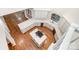 Open kitchen with white cabinets, hardwood floors, large center island, and stainless steel appliances at 6823 Manatee Dr, Concord, NC 28025